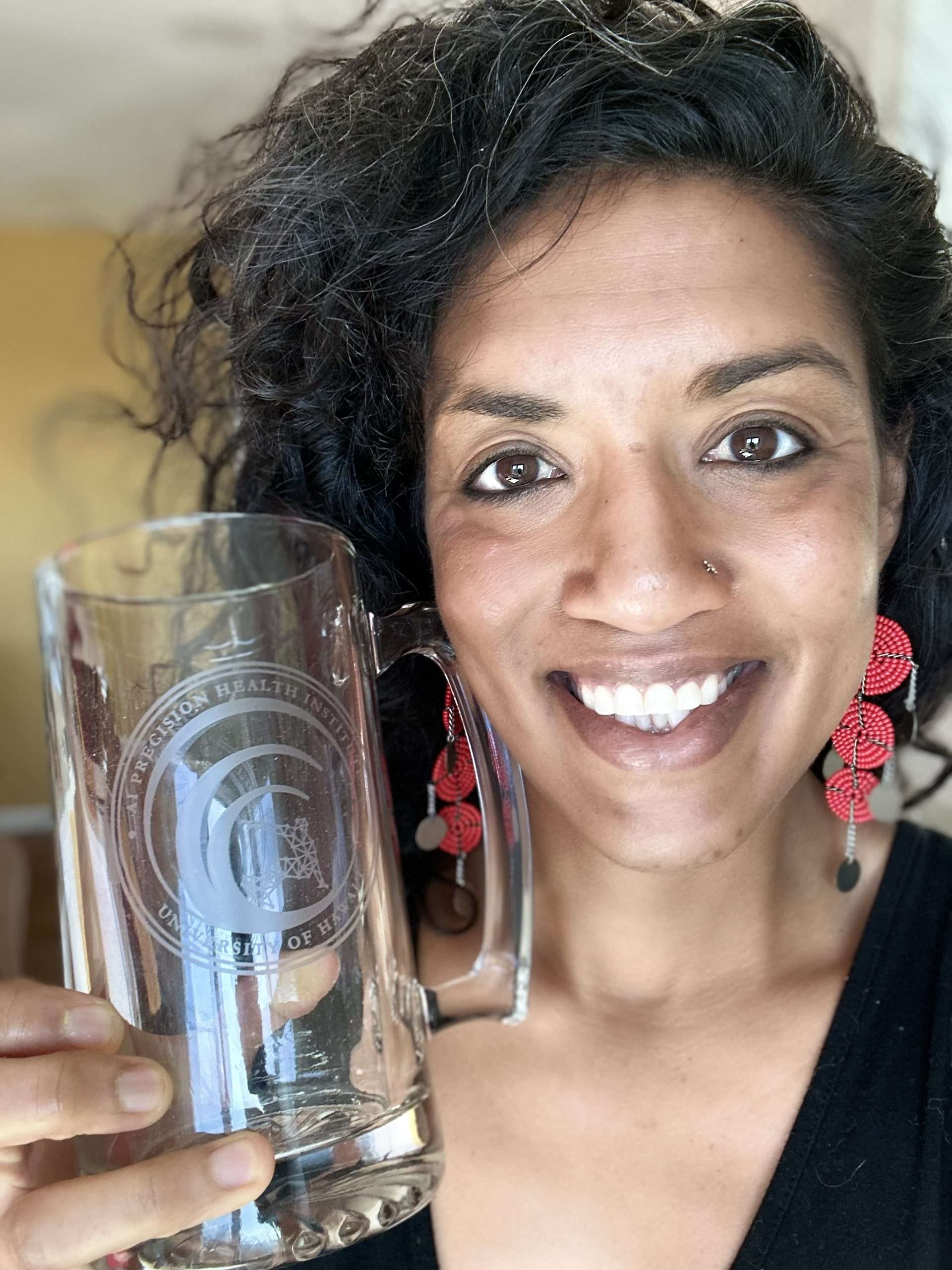 Aekta Shah with their AI PHI beer stein