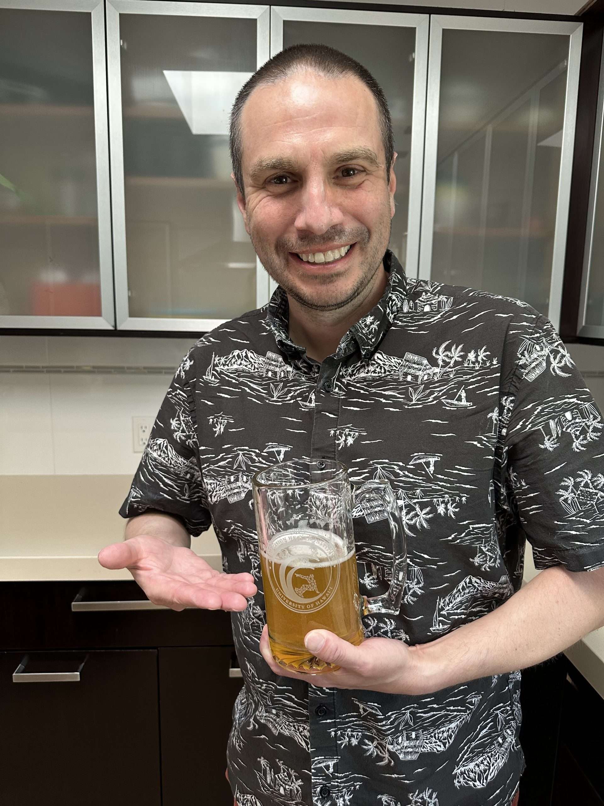 Rory Sayres with their AI PHI beer stein
