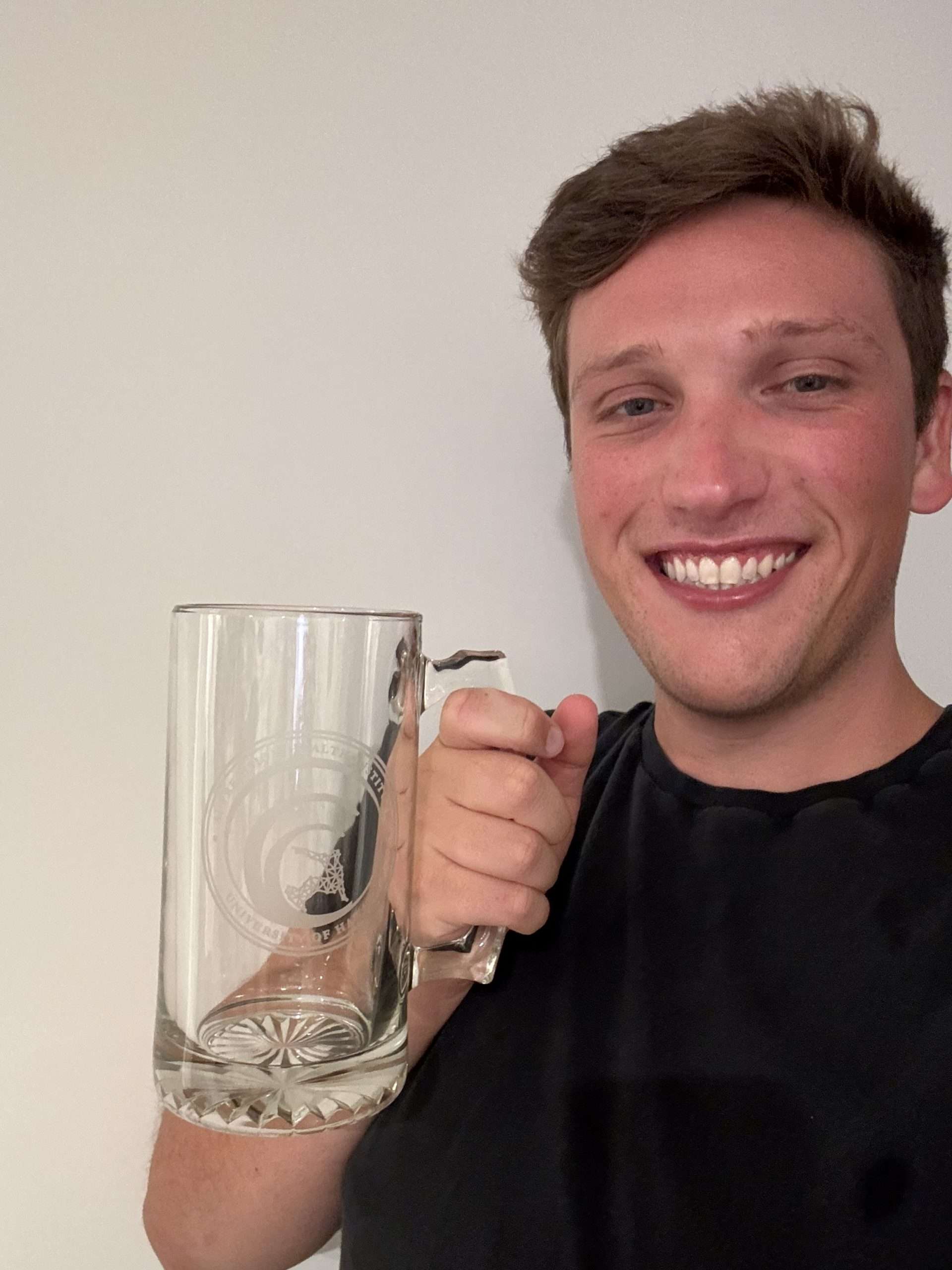 William Rudman with their AI PHI beer stein